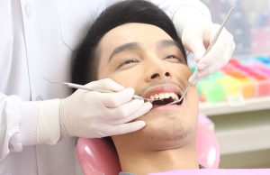 patient with dentist during checkup