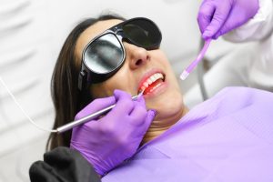 patient receives modern periodontal laser therapy