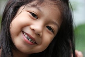 girl with dental crowns