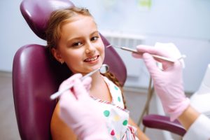 child in dental chair